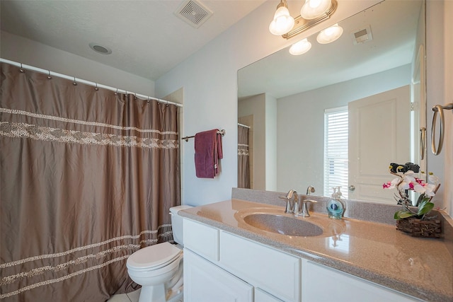 bathroom with toilet, a shower with shower curtain, vanity, and visible vents