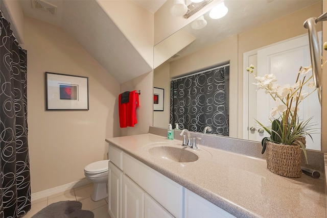 bathroom featuring lofted ceiling, visible vents, toilet, vanity, and tile patterned flooring