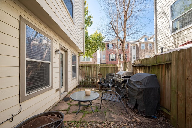 view of patio featuring fence and grilling area