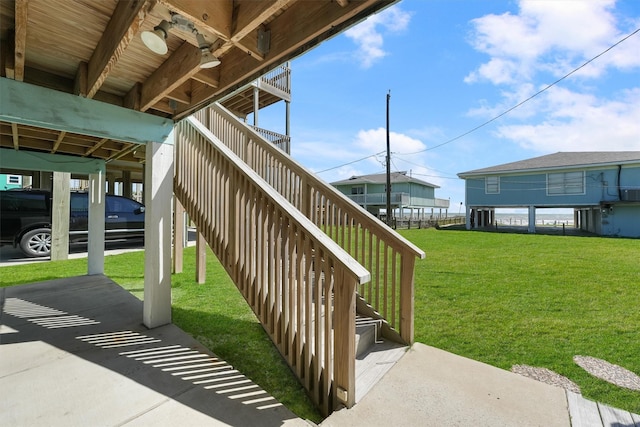 view of patio with a carport and stairway