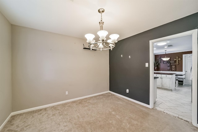 spare room featuring baseboards, light carpet, and an inviting chandelier