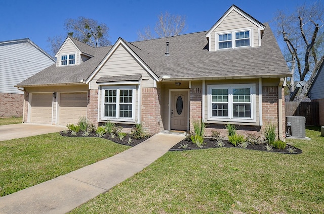 view of front of property featuring a front lawn, cooling unit, and brick siding