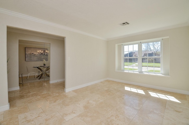 spare room with baseboards, visible vents, a chandelier, and ornamental molding