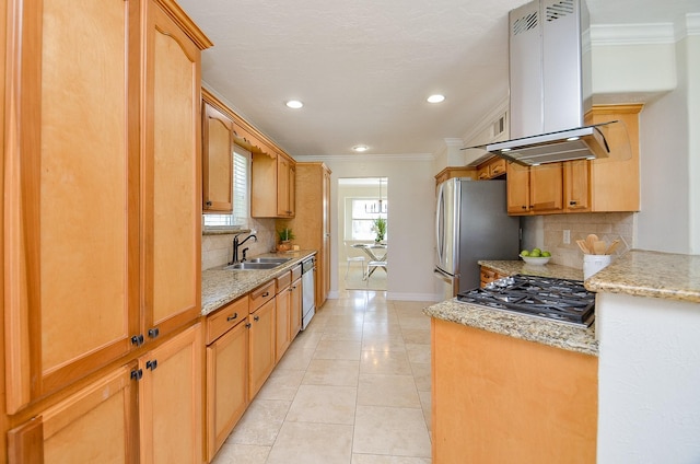 kitchen featuring island exhaust hood, appliances with stainless steel finishes, crown molding, and a sink