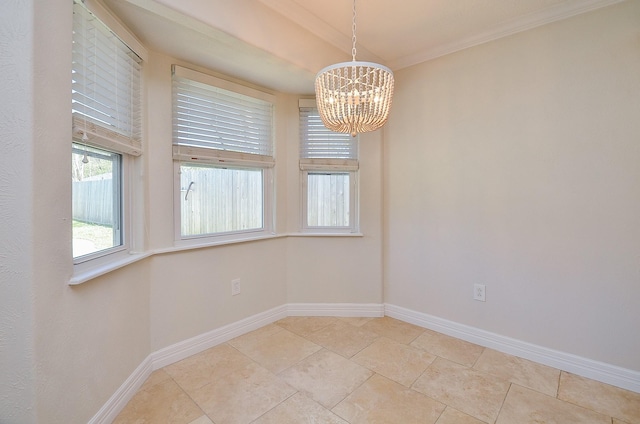 empty room with ornamental molding, light tile patterned flooring, baseboards, and a chandelier