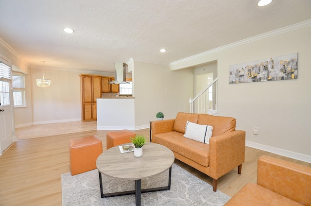 living area with light wood-style flooring and ornamental molding