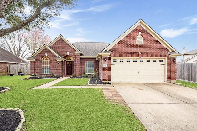 view of front of house featuring brick siding, an attached garage, fence, a front yard, and driveway