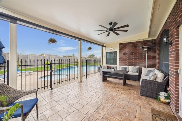 view of patio featuring outdoor lounge area, a fenced backyard, a fenced in pool, and ceiling fan