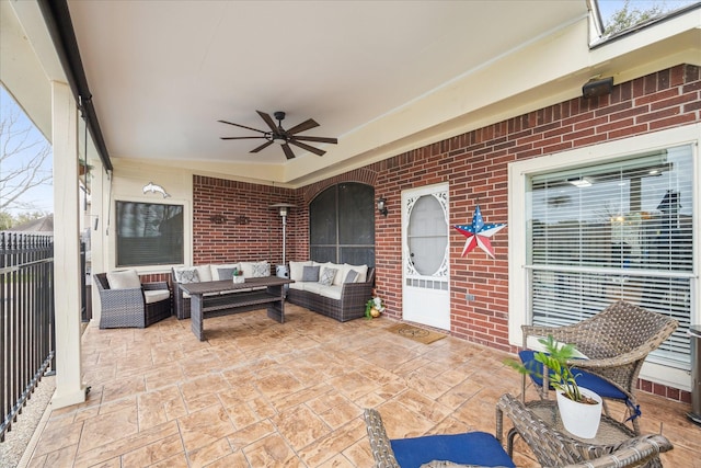 view of patio featuring outdoor lounge area, a ceiling fan, and fence