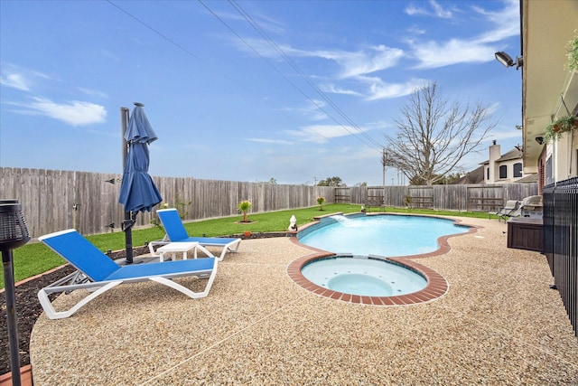 view of pool with a fenced backyard, a fenced in pool, an in ground hot tub, and a patio