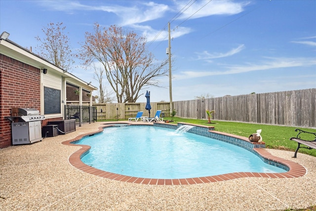 view of swimming pool with a fenced in pool, a yard, a fenced backyard, a patio area, and a grill