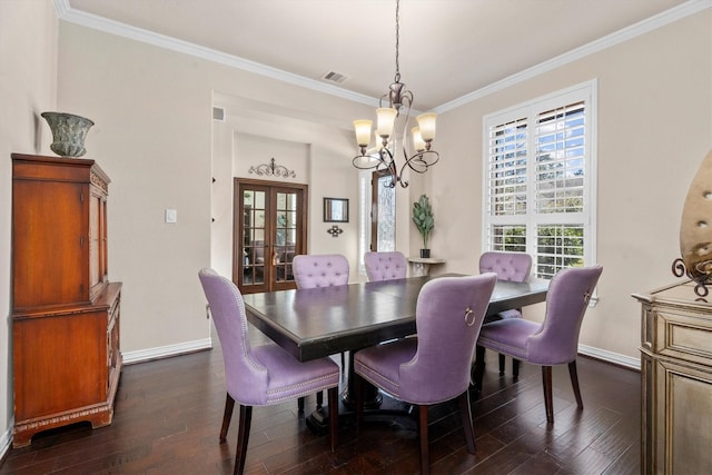 dining space featuring dark wood-type flooring, french doors, ornamental molding, and baseboards