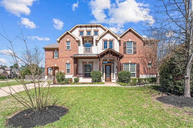 craftsman-style home with a front yard and brick siding