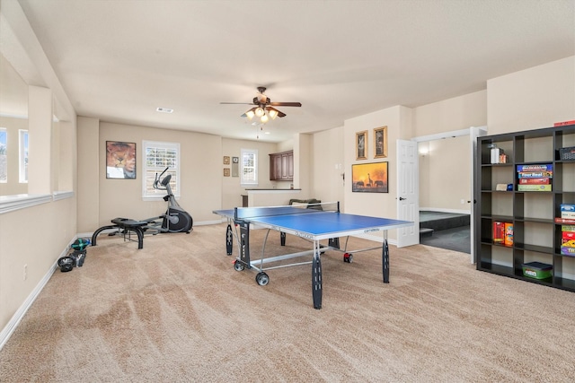 recreation room featuring carpet floors, visible vents, baseboards, and a ceiling fan