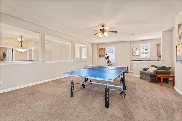 recreation room with a ceiling fan, carpet, visible vents, and baseboards