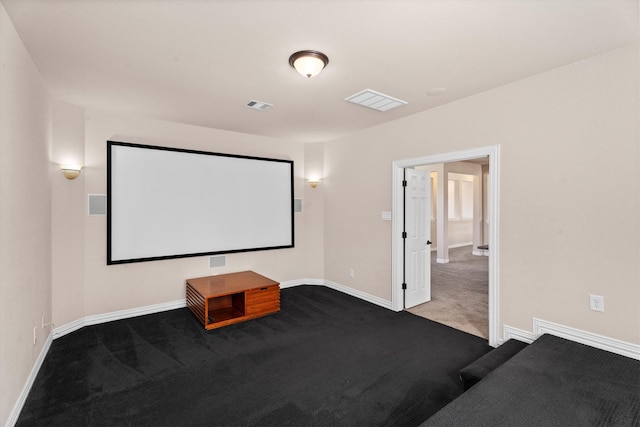 carpeted home theater featuring baseboards and visible vents