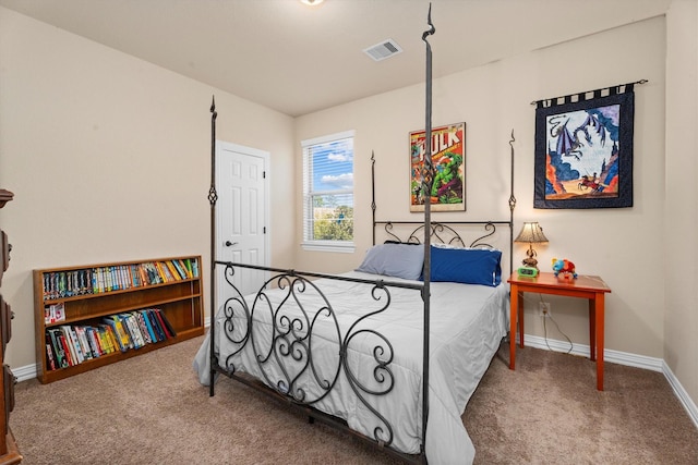 carpeted bedroom featuring visible vents and baseboards