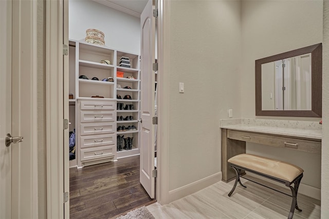 walk in closet featuring dark wood-style flooring