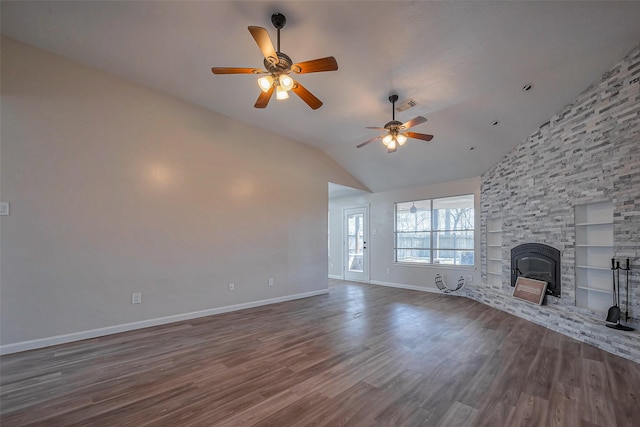 unfurnished living room featuring a fireplace, wood finished floors, visible vents, built in features, and baseboards