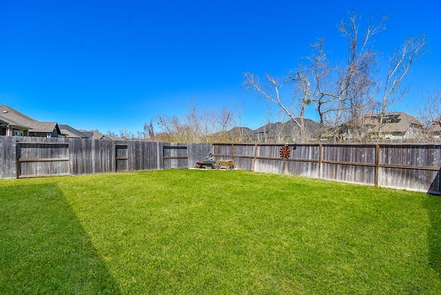 view of yard featuring a fenced backyard