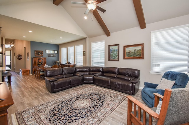 living room with beamed ceiling, ceiling fan with notable chandelier, high vaulted ceiling, and wood tiled floor