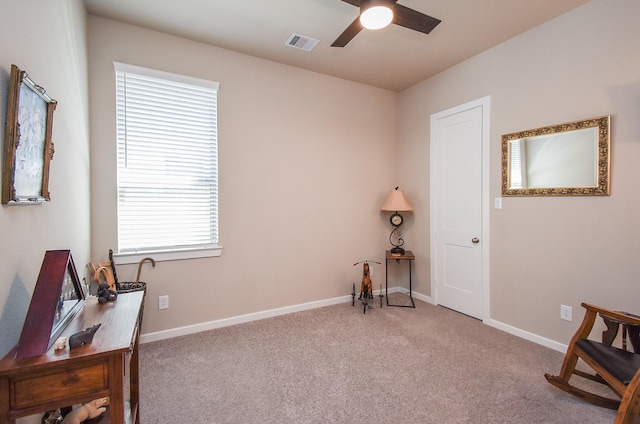 sitting room featuring baseboards, visible vents, carpet floors, and ceiling fan