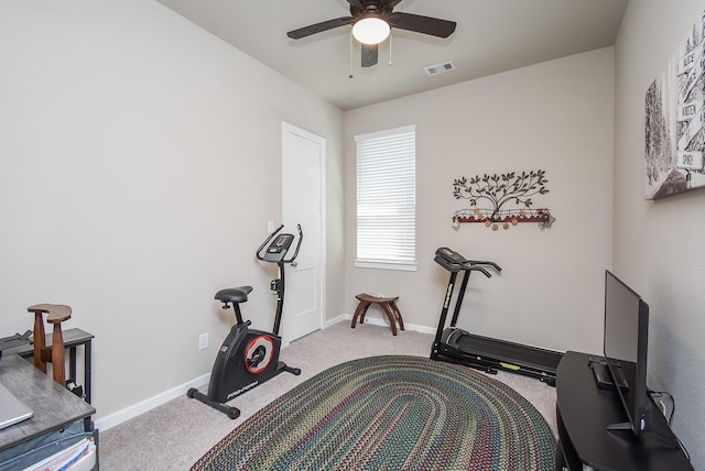 exercise area featuring visible vents, baseboards, carpet, and ceiling fan