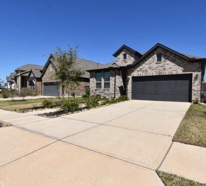 french provincial home featuring driveway and an attached garage