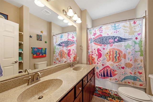 full bathroom featuring toilet, visible vents, a sink, and shower / tub combo with curtain