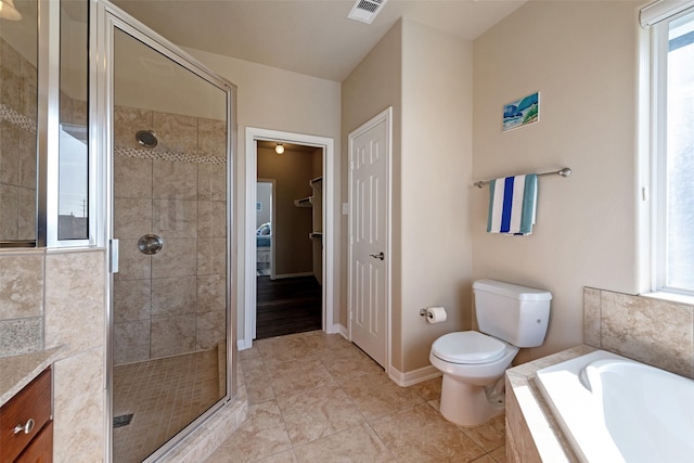 full bath with visible vents, toilet, a shower stall, baseboards, and a bath