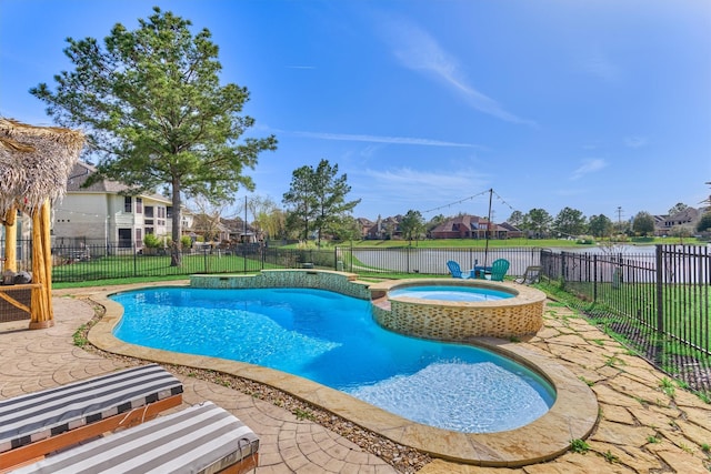 view of pool with a residential view, a pool with connected hot tub, a fenced backyard, and a patio