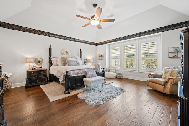 bedroom featuring lofted ceiling, baseboards, visible vents, and hardwood / wood-style floors