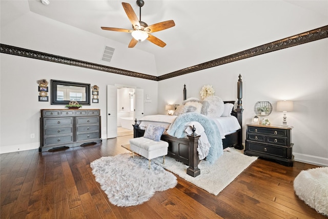 bedroom with visible vents, baseboards, ensuite bath, wood-type flooring, and ceiling fan