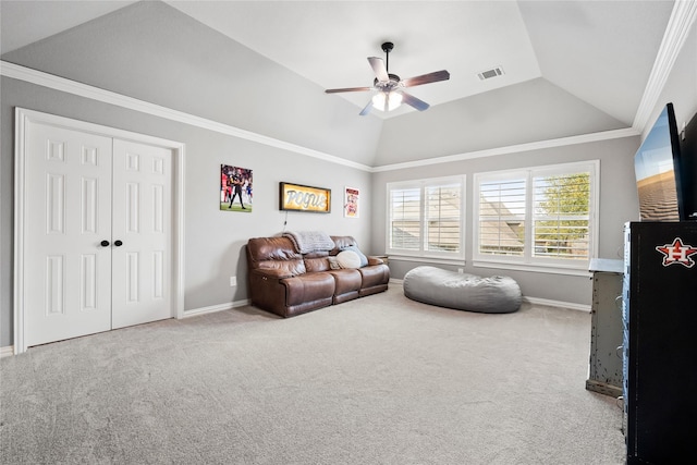 living area featuring baseboards, visible vents, lofted ceiling, crown molding, and carpet flooring