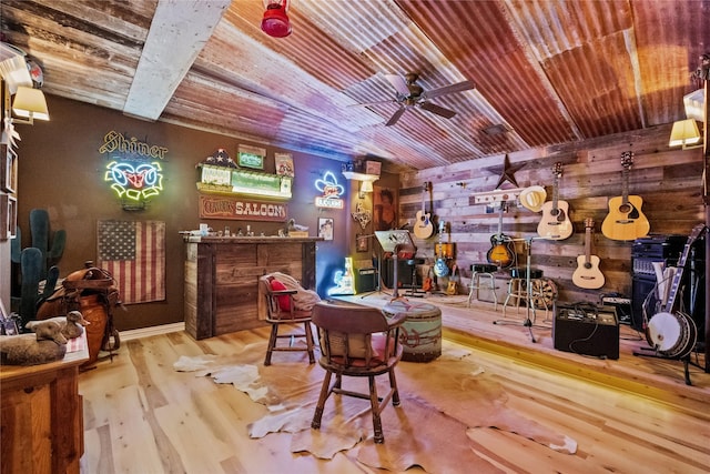 interior space featuring a dry bar, wooden ceiling, wood finished floors, and a ceiling fan