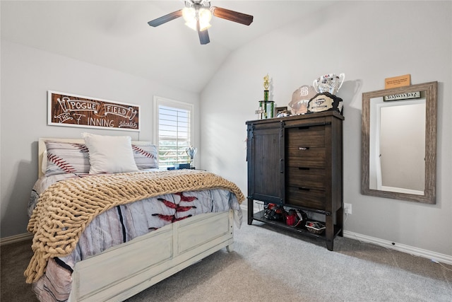 carpeted bedroom with lofted ceiling, a ceiling fan, and baseboards