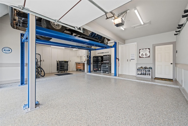 garage featuring a garage door opener