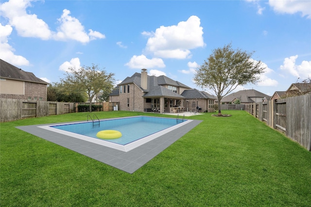 view of swimming pool with a yard, a patio, a fenced backyard, and a fenced in pool