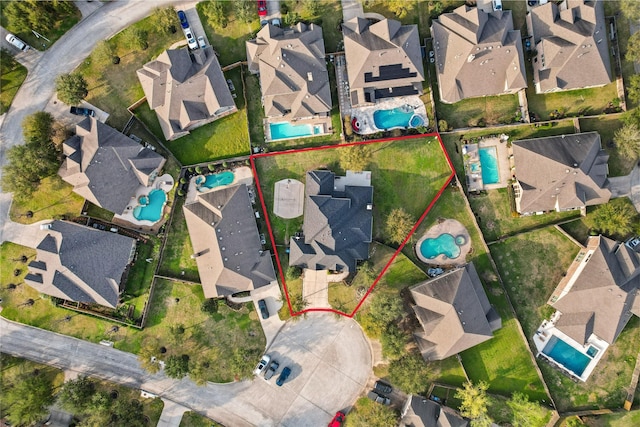 birds eye view of property with a residential view