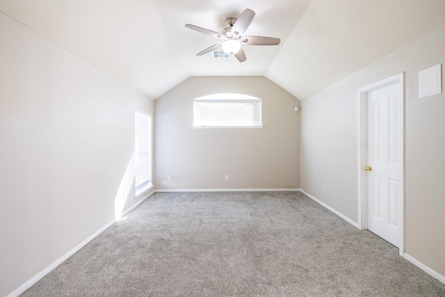 bonus room featuring carpet flooring, vaulted ceiling, baseboards, and ceiling fan