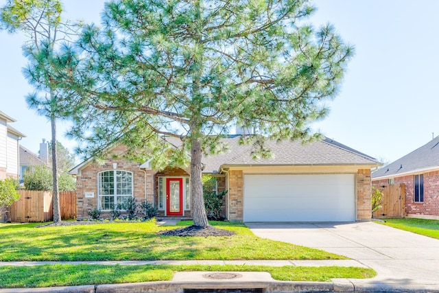 ranch-style home with a garage, concrete driveway, a front yard, and fence