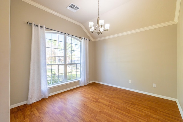 unfurnished room with light wood-type flooring, visible vents, a notable chandelier, and ornamental molding