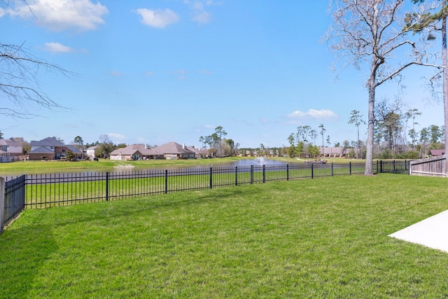 view of yard featuring a residential view and fence