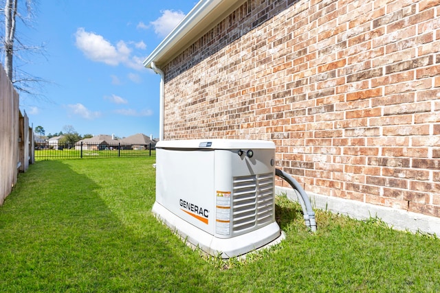 exterior details with a power unit, brick siding, and fence