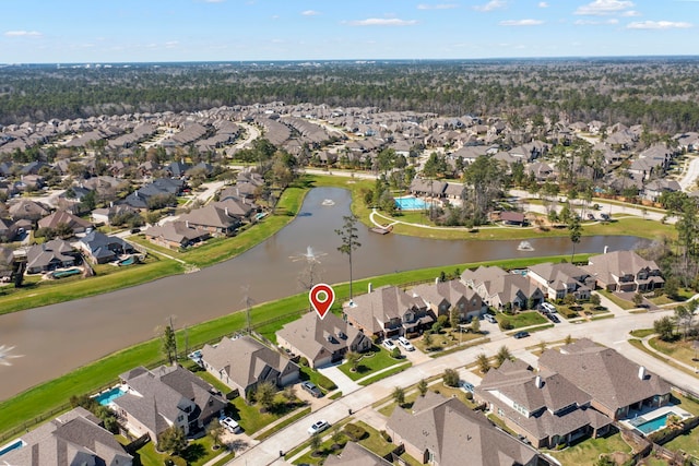 bird's eye view with a residential view and a water view