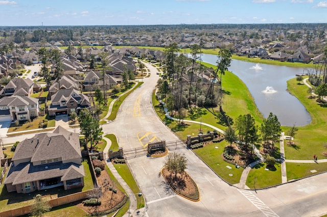 birds eye view of property featuring a residential view and a water view