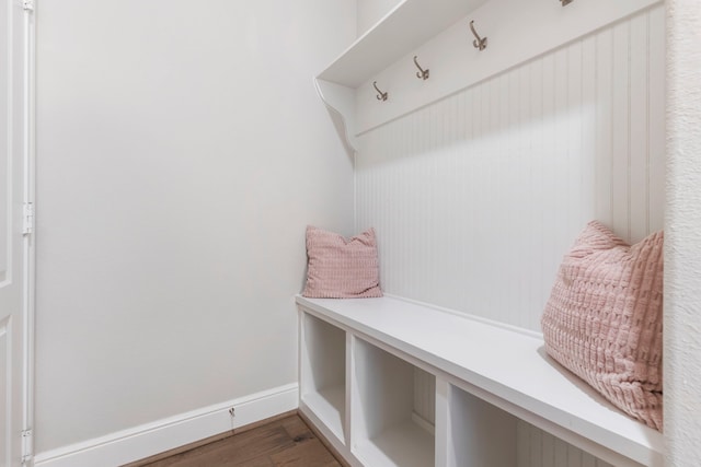 mudroom with baseboards and wood finished floors