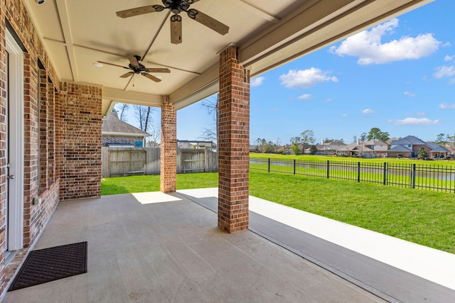 view of patio with a residential view, ceiling fan, and a fenced backyard