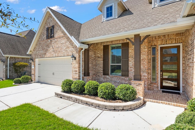 exterior space featuring a porch, brick siding, roof with shingles, and concrete driveway