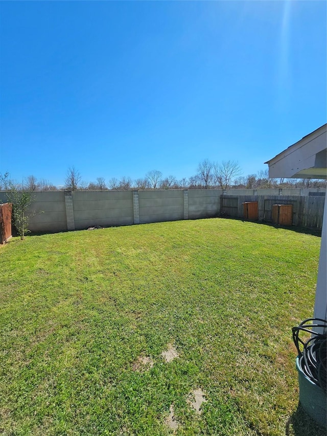 view of yard featuring a fenced backyard